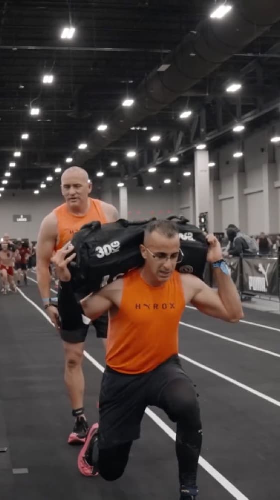 Centr member sprinting at a HYROX event